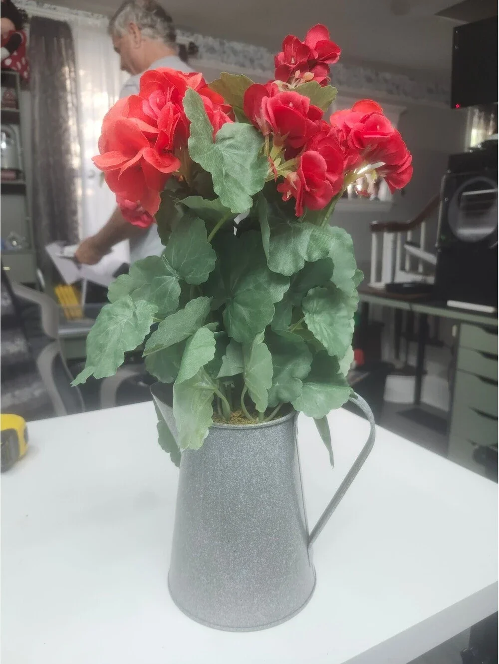 Artificial Red Geranium Flowers in Gray Metal Pitcher Vase